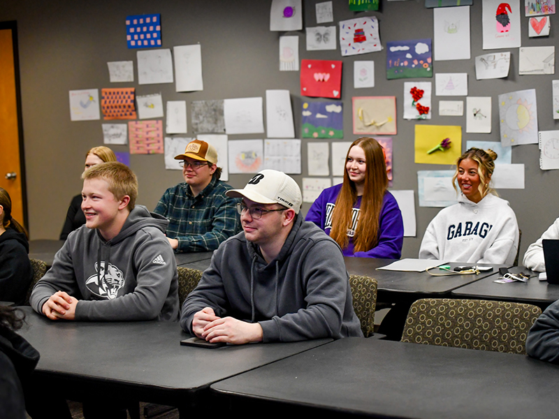 Students gathered during an education club meeting. 