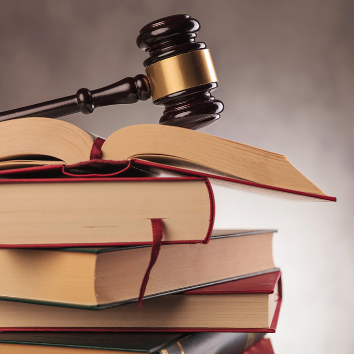 gavel on top of stack of books