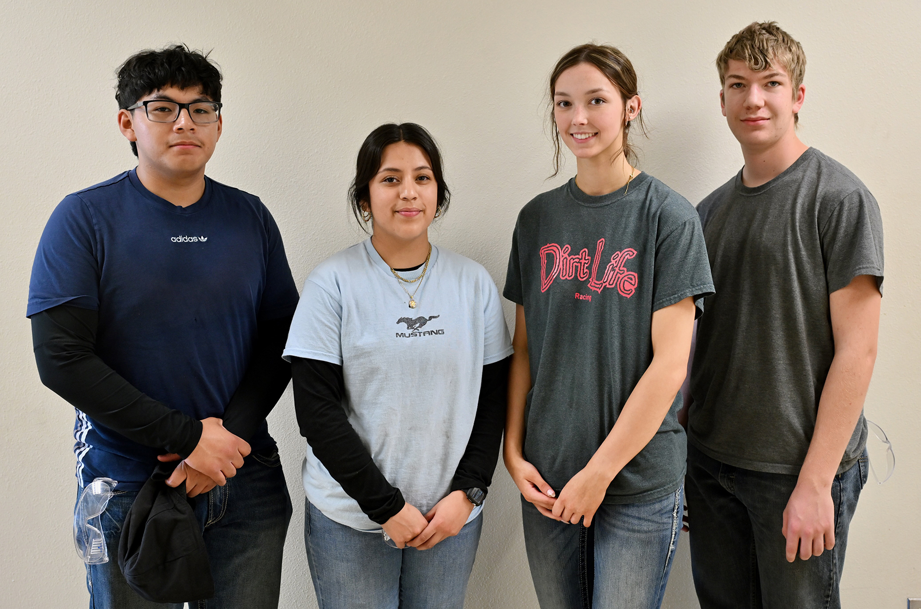 four students from the afternoon welding course posing for a photo