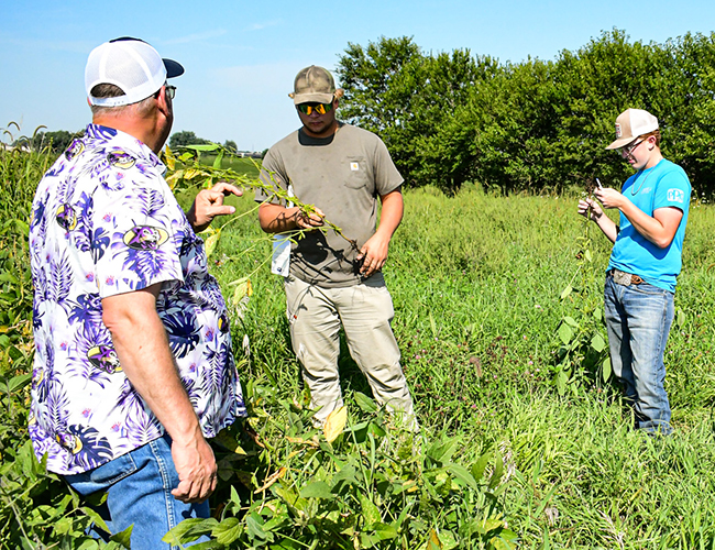 students and instructor in field