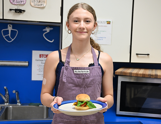 female student holding food