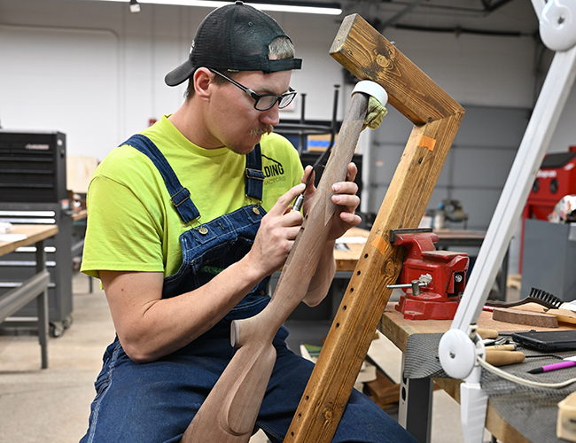 student working on firearm projects