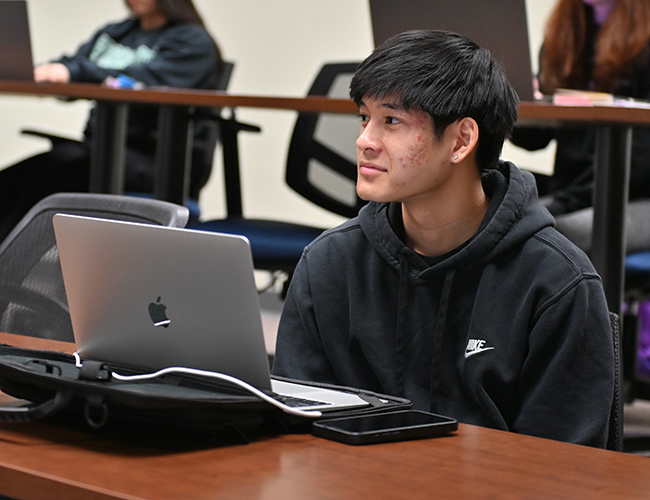 student sitting in classroom