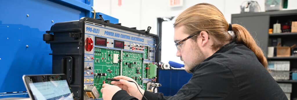 Electro_mechanical_student_working_in_lab